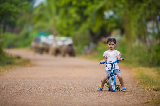 Cute Girl Riding Her Bike