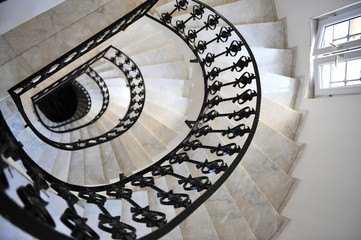 Fototapeta premium winding stairs with the forged rails