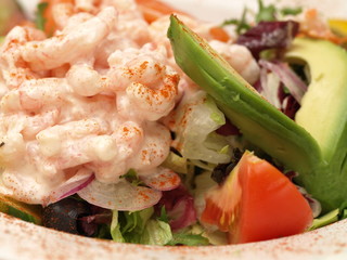 closeup of prawns and avocado salad,