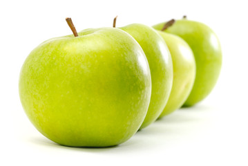 apples in row isolated on white