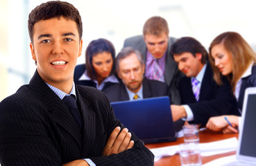 Happy business people seated in a row.