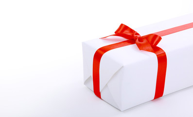 gift wrapped with a red ribbon on a white background.