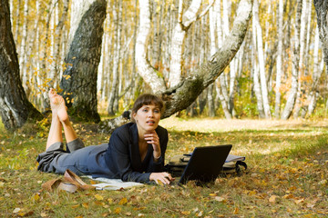 Fototapeta premium Young businesswoman on nature.