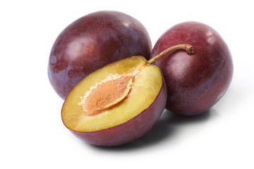 Fresh  plums  on the white background
