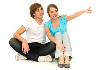 Obraz na płótnie Canvas Teenage couple pointing