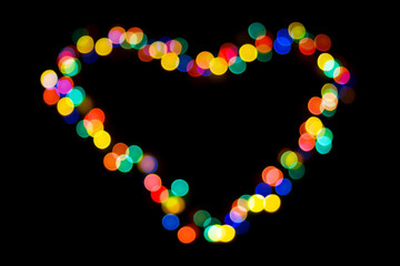 A heart made of colorful lights on black