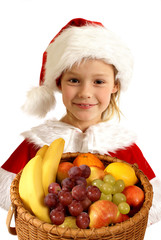 Little Christmas girl  with fruit basket