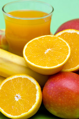 glass of fresh juice and fresh fruits