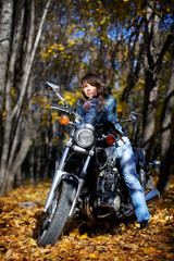 Fototapeta na wymiar The brunette girl and power motorcycle