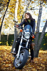 Fototapeta na wymiar The girl the brunette on a motorcycle