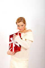Young happy winter woman with red present