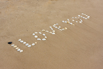 I Love you in sand on a a beach