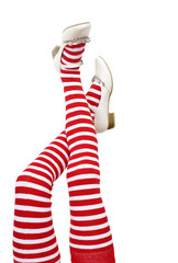 head over heels. female legs in stripy stockings;