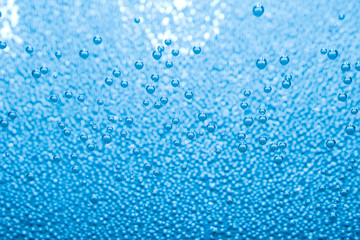 Macro of blue air bubbles in water