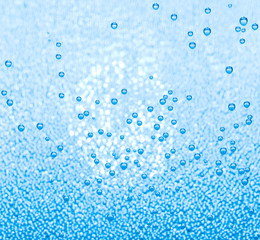 Macro of blue air bubbles in water