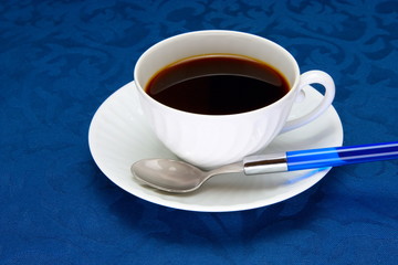 Cup of  coffee on a blue background