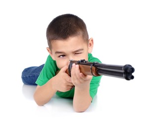 boy aiming a gun, isolated on white