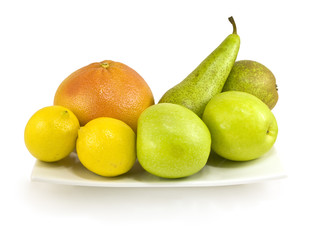 Dish with fruit isolated on white