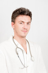 Young male doctor with medical stethoscope
