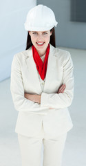 Attractive female architect with folded arms