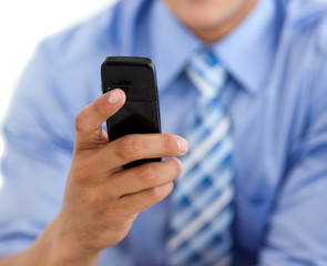 Close-up of a businessman sending a text