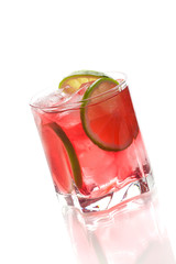 Fototapeta na wymiar Red alcohol cocktail with lime slices