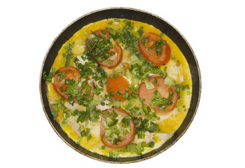 Omelet with herbs and tomatoes in plate isolated on white