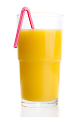 Glass of orange juice with tube