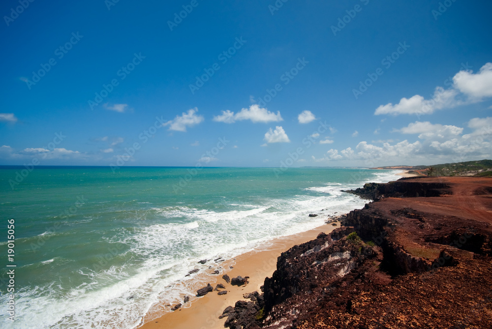 Wall mural cliffs and beach at praia das minas