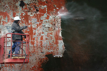 scraping surface before painting ship