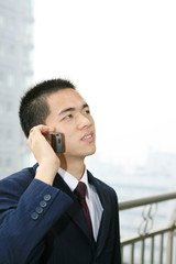 young asian businessman On the Balcony listen to the phone call