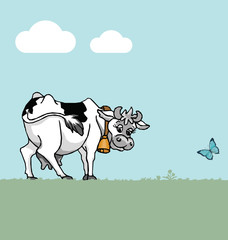 Cow in field with blue sky and clouds