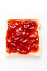 slice of bread and strawberry marmalade