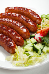 Grilled sausages and vegetables