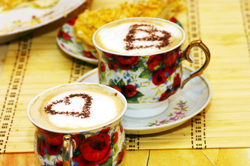 Cappuchino, with chocolate heart and cake