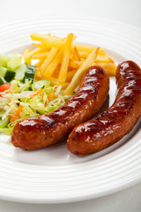 Grilled sausages and vegetables