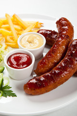 Grilled sausages and vegetables