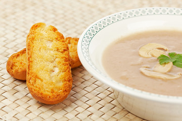 Cream of mushroom soup and bread croutons