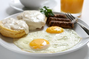 Foto op Plexiglas Spiegeleieren Fried Eggs and Biscuits and Gravy