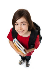Young girl holding books, looking up isolated on white