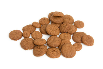 Home baked pepernoten cookies over white background