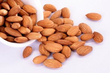 Fresh almonds on white