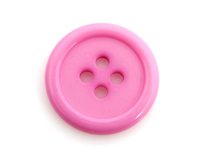 Closeup of pink clothing button over white background
