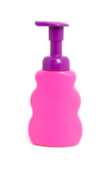 Pink soap bottle over white background