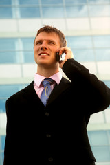 Young businessman calling on mobile phone, outdoor