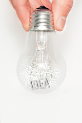 Hand with light bulb full of ideas