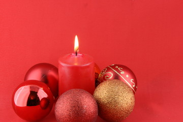 Christmas still life with red candles and balls