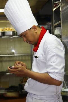 chef using PDA at work