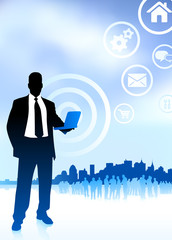 businessman holding computer