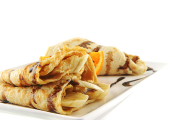 two pancakes on porcelan dish